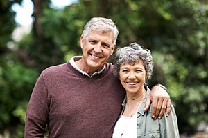 Older couple enjoying the benefits of dental implants in Gainesville
