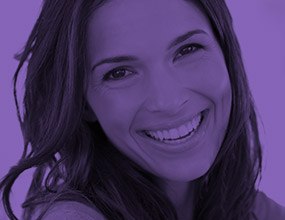 Young woman with gorgeous smile highlighted purple