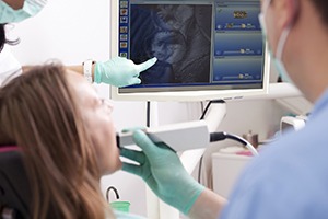 Woman and dentist looking at intraoral photo